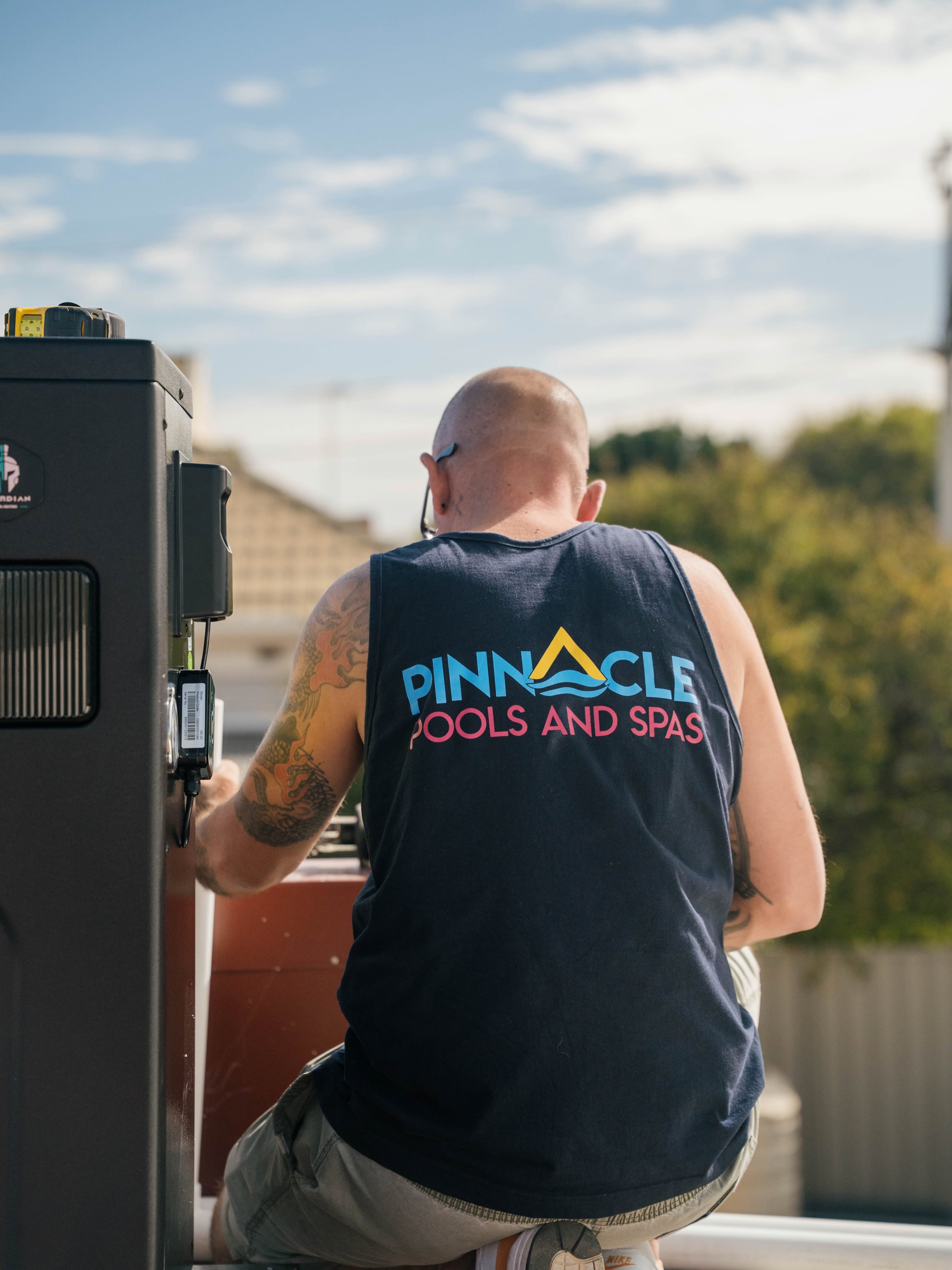 Lee from Pinnacle Pools & Spas servicing pool equipment